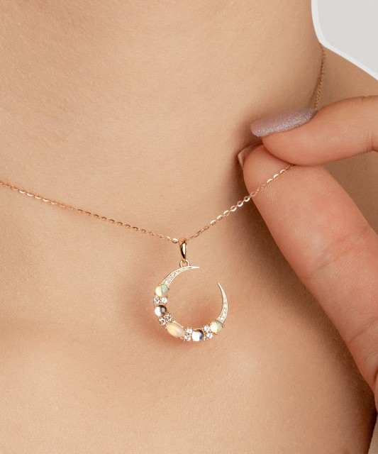 Geltono aukso pakabukas su deimantais, opalais ir topazais