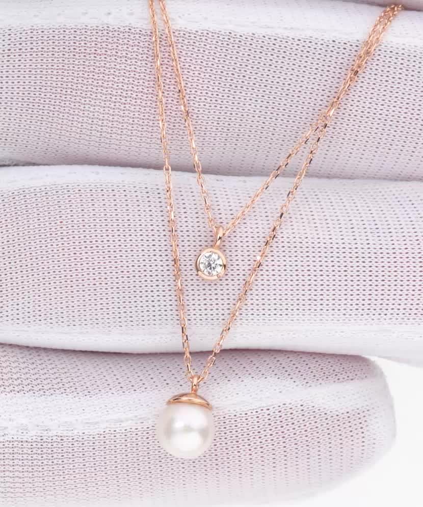 Auksinė grandinėlė su perlo pakabuku